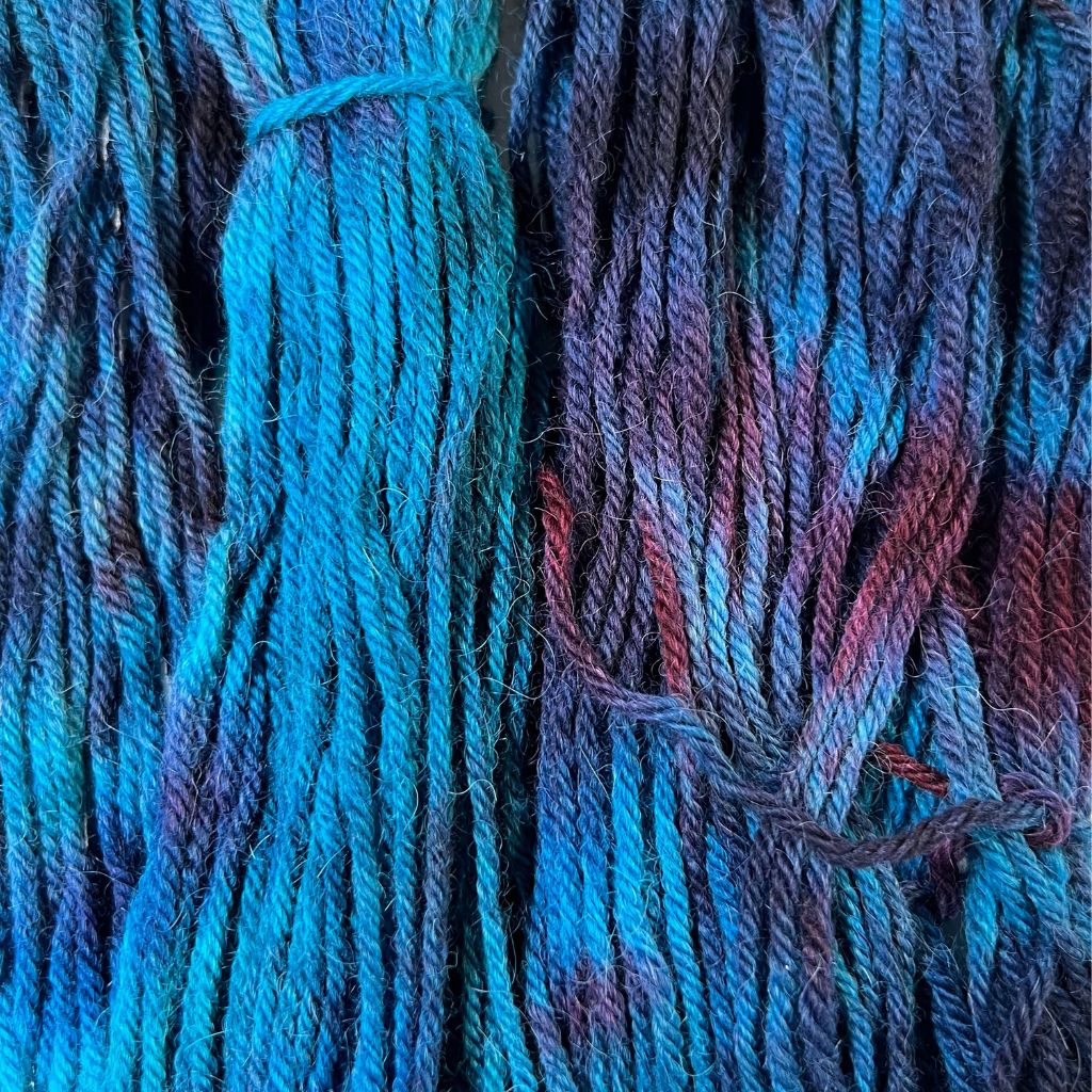 About the Color Subdued Blues with Shadowed Burgundy Hand-Dyed Yarn with rich teal & turquoise blues