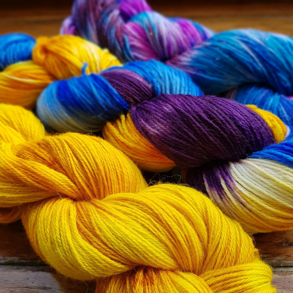 Yarn Kit | Fingering & Sock Yarn Kit |  3 Hanks Yellow, Purple, Blue Cali Sunshine, Three Skein Fade, Sock Weight Yarn Designers Boutique