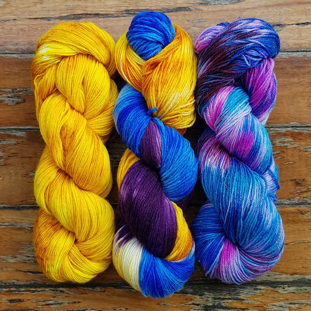 Yarn Kit | Fingering & Sock Yarn Kit |  3 Hanks Yellow, Purple, Blue Cali Sunshine, Three Skein Fade, Sock Weight Yarn Designers Boutique