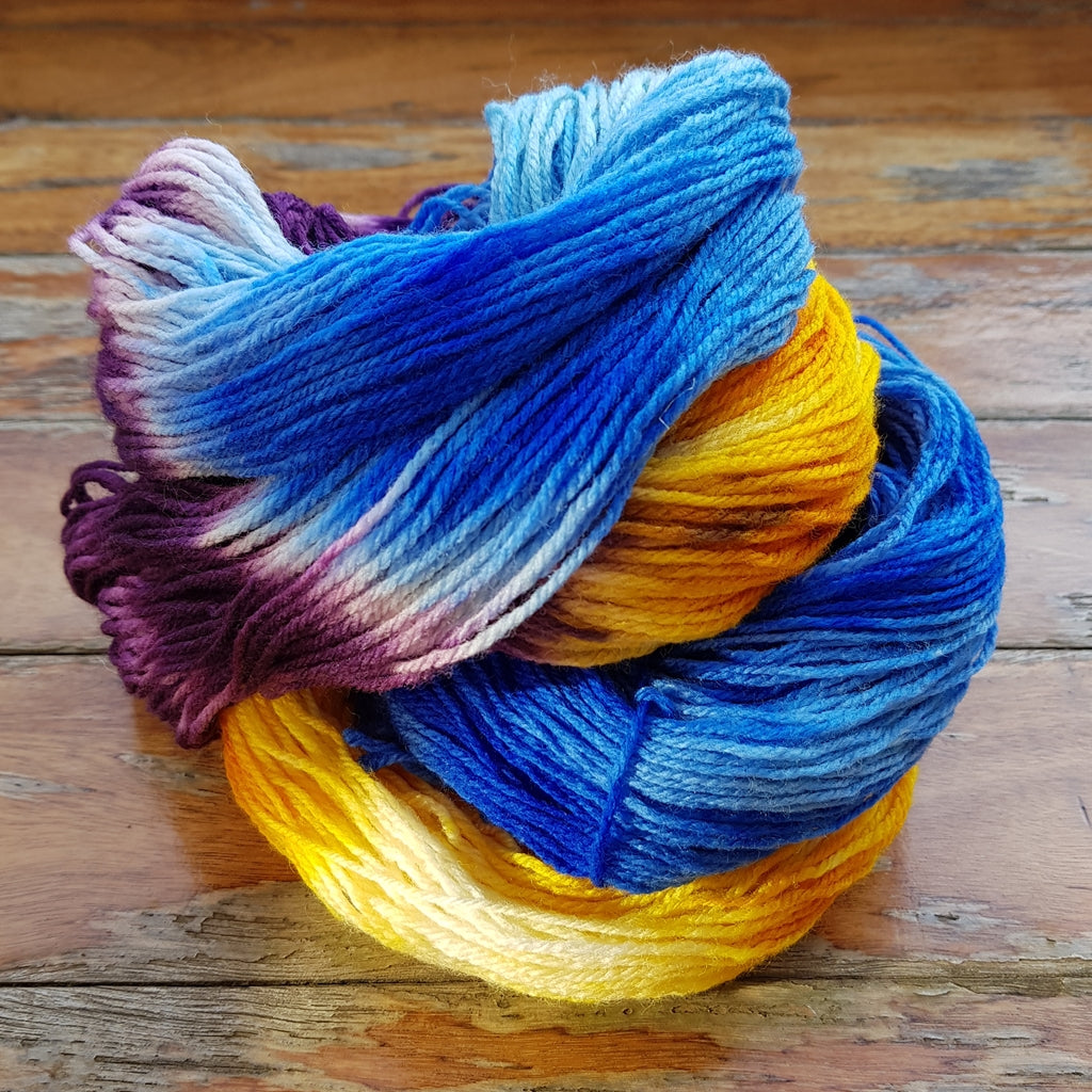 Hand Painted Sock Yarn, Merino & Nylon, Gold, Purple, & Blue Yarn Caribbean Party Hand-Painted Sock Yarn, Purple, Gold, Sky Blue Yarn Designers Boutique