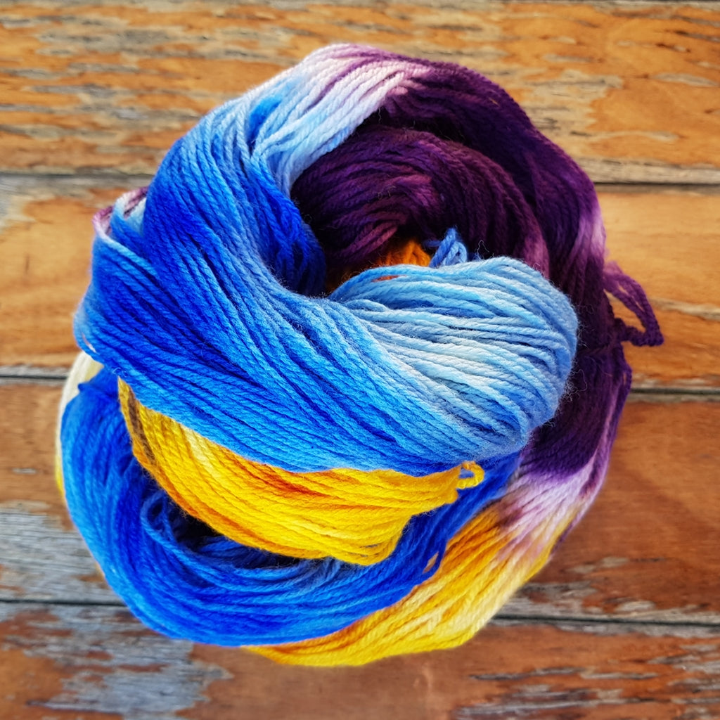 Hand Painted Sock Yarn, Merino & Nylon, Gold, Purple, & Blue Yarn Caribbean Party Hand-Painted Sock Yarn, Purple, Gold, Sky Blue Yarn Designers Boutique