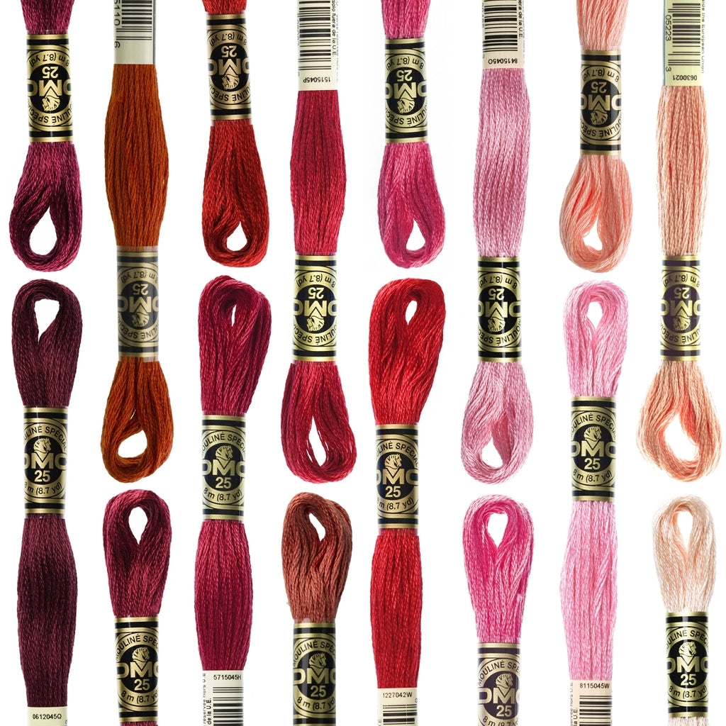 image of embroidery floss skeins arranged by colors from red to pink to peach