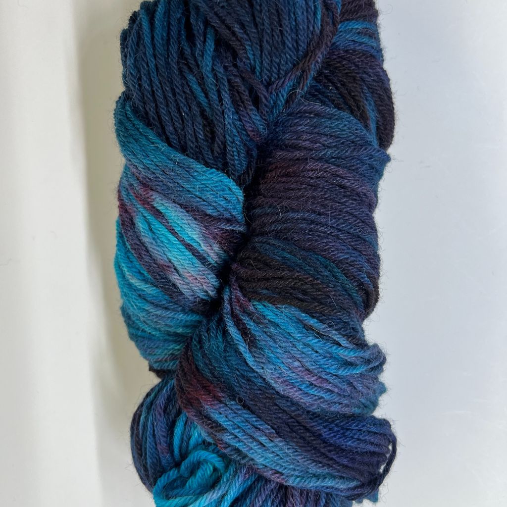 About the Color Subdued Blues with Shadowed Burgundy Hand-Dyed Yarn with rich teal & turquoise blues