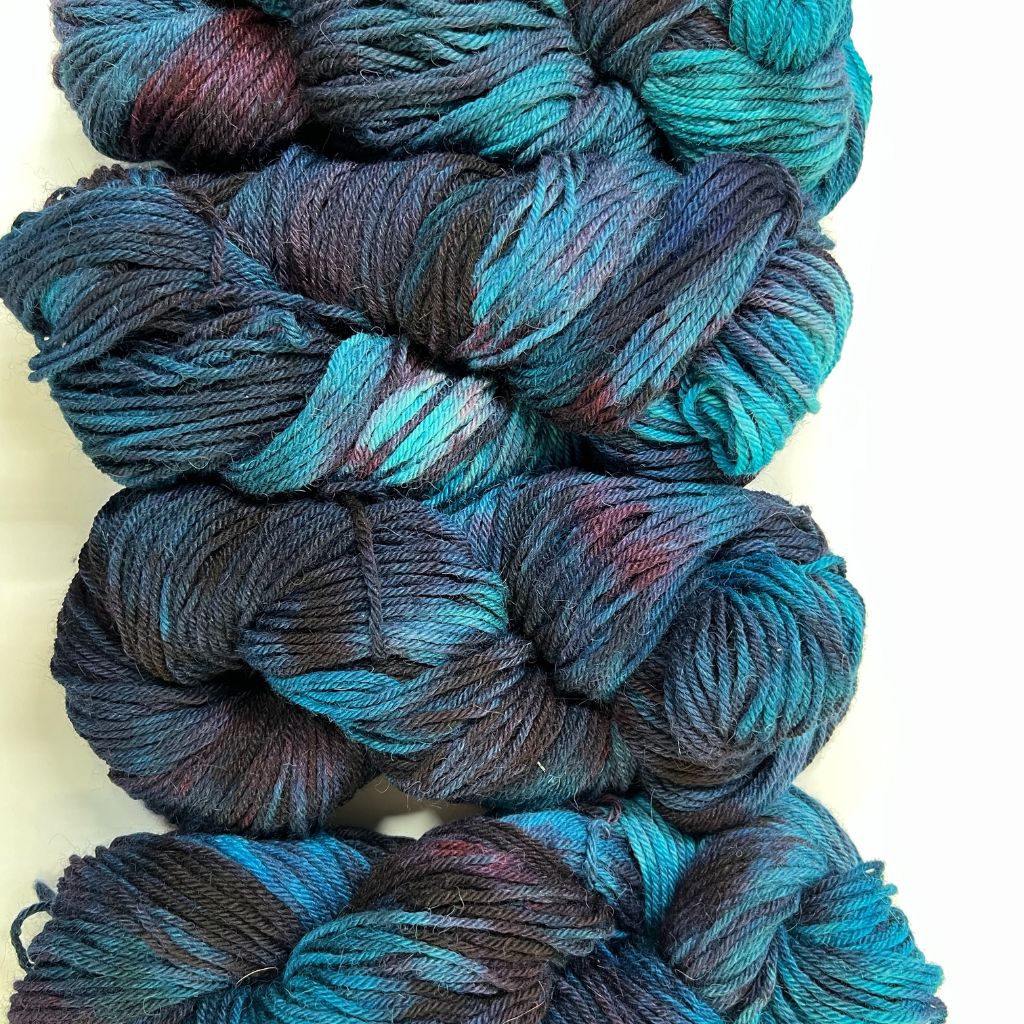 About the Color Subdued Blues with Shadowed Burgungy Hand-Dyed Yarn - Teal and turquoise blues