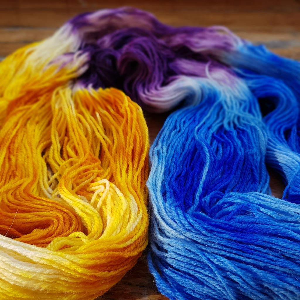 Hand Painted Sock Yarn, Merino & Nylon, Gold, Purple, & Blue Yarn Caribbean Party Hand-Painted Sock Yarn, Purple, Gold, Sky Blue Yarn Designers Boutique