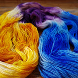Hand Painted Sock Yarn, Merino & Nylon, Gold, Purple, & Blue Yarn Caribbean Party Hand-Painted Sock Yarn, Purple, Gold, Sky Blue Yarn Designers Boutique